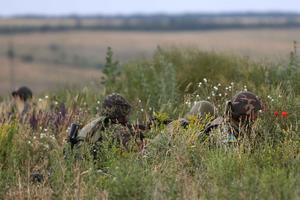 У Новоазовска пограничники дали бой террористам с белыми повязками 