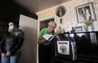 Последний день голосования в Госдуму России продолжается на фоне массовых нарушений