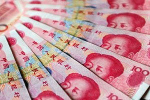 Китай снова девальвировал юань