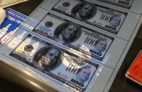 У Києві викрили фальшивомонетників: вилучено лінію з виготовлення підроблених доларів США