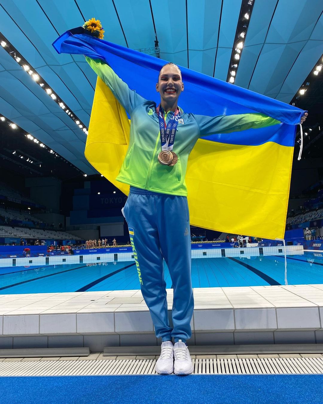 Марта Фєдіна з олімпійськими медалями токійських Ігор-2020.