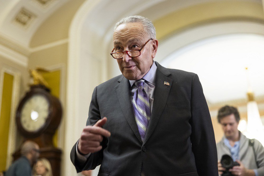 Senate Democratic Majority Leader Chuck Schumer answers reporters' questions about the border deal at Capitol in Washington, DC, on 6 February 2024 