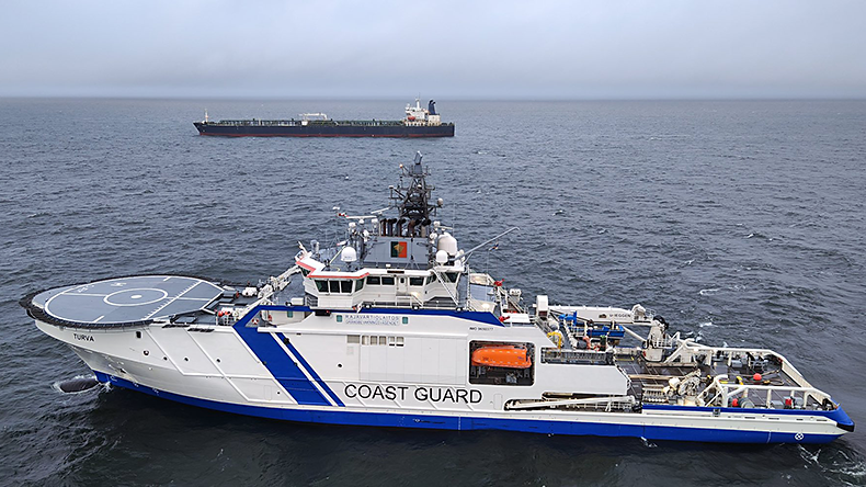 The Finnish Coast Guard ship is checking the <i>Eagel S</i> (in the background) after a possible cable sabotage.