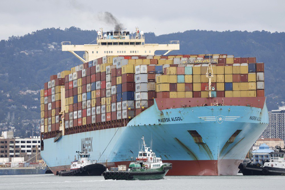 A tugboat guides a container ship at the Port of Oakland in Oakland, California, USA, 3 February 2025.