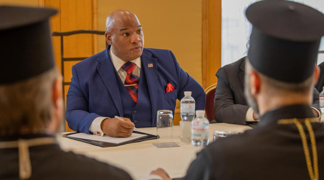 Pastor Mark Burns participates in an interfaith religious forum in Kyiv.