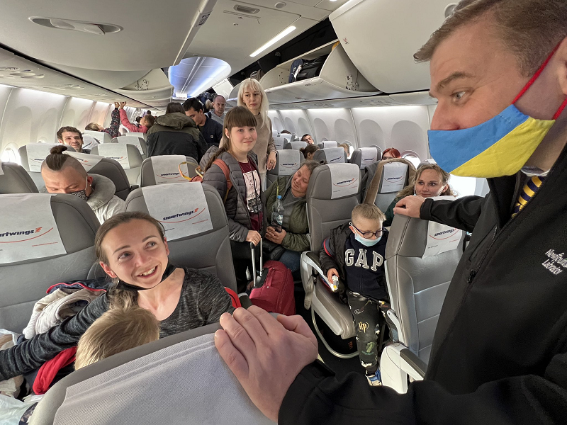  Ukrainian refugees on a plane on their way to Canada.