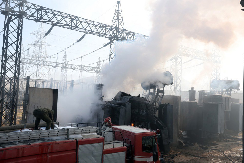 Firefighters extinguish a fire after airstrikes hit a power plant in Sanaa, Yemen, 19 December 2024