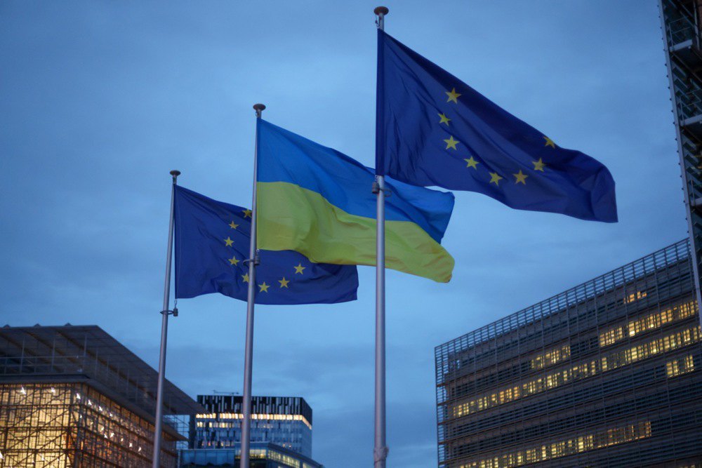 The flags of the EU and Ukraine in front of the European Union headquarters during the EU Foreign Affairs Council meeting in Brussels on 24 February, 2025