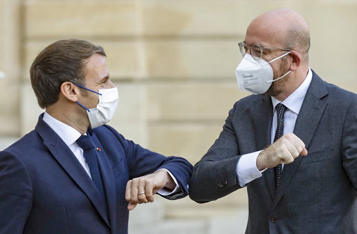 rench President Emmanuel Macron (left) greets European Council President Charles Michel before the opening of the Peace
Forum at the Elysee Palace, Paris, 12 November 2020