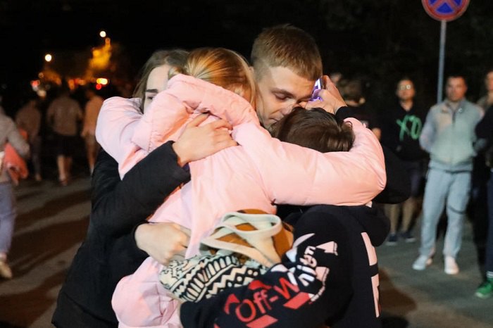 Relatives and friends greet people after their release from a pre-trial detention centre in Minsk