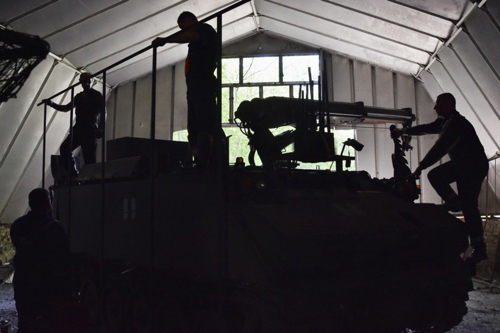 Ukrainian Armed Forces personnel install a frame for an anti-drone net on a Dutch armoured tracked evacuation vehicle YPR-806 PRBRG, Zaporizhzhya direction, 24 April 2025.