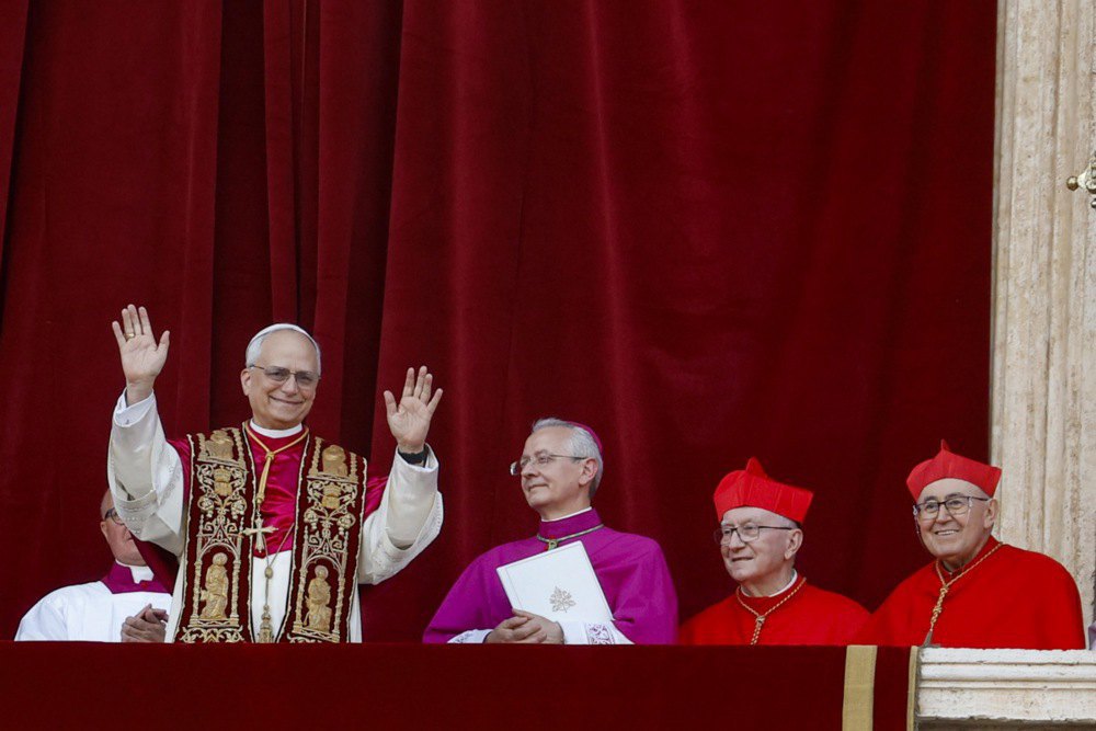 The newly elected Pope Leo XIV, Cardinal Robert Francis Prevost of the United States, blesses the faithful from the central loggia of St Peter's Basilica in the Vatican, 8 May 2025.