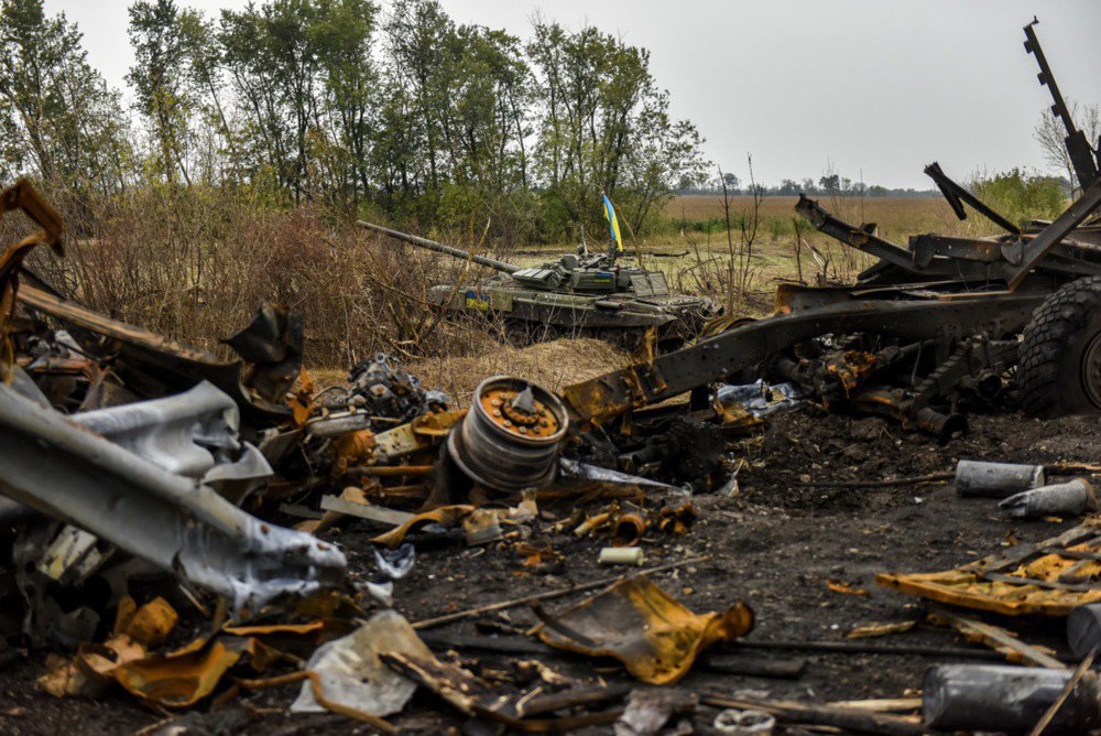  Ukrainian tank moving through Kharkiv Region, with destroyed Russian equipment in the foreground, 15 September 2022