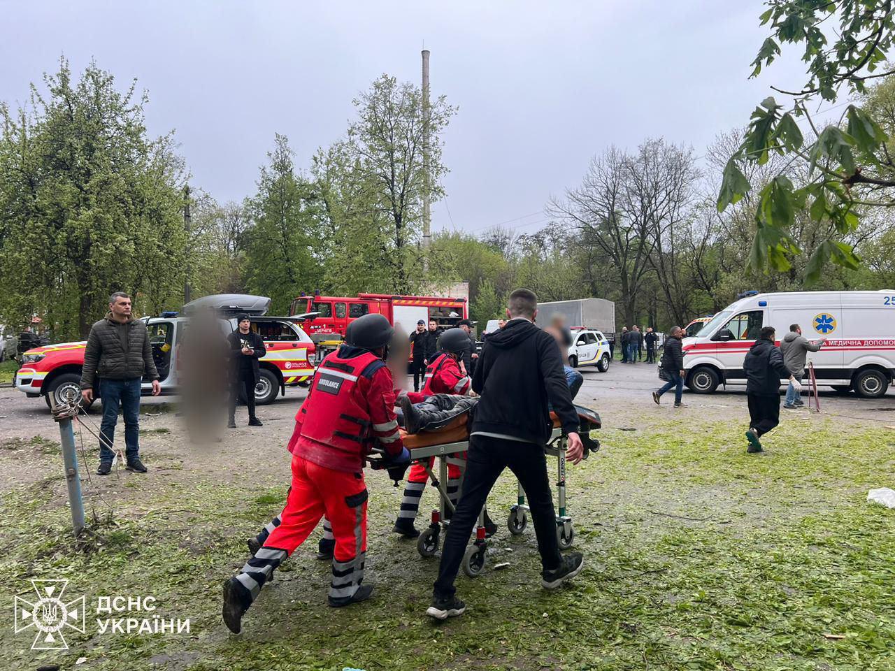 Rescuers provide assistance to victims at the site of the shelling of Chernihiv, 17 April 2024