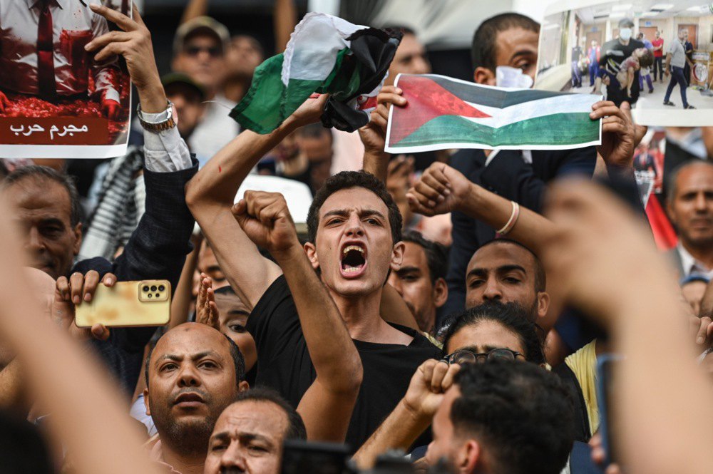 Protesters demonstrate in support of the Palestinian people after a hospital in the Gaza Strip was struck, Cairo, Egypt, 18 October 2023