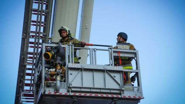 Rescuers at the scene of an attack on critical infrastructure in Nizhyn