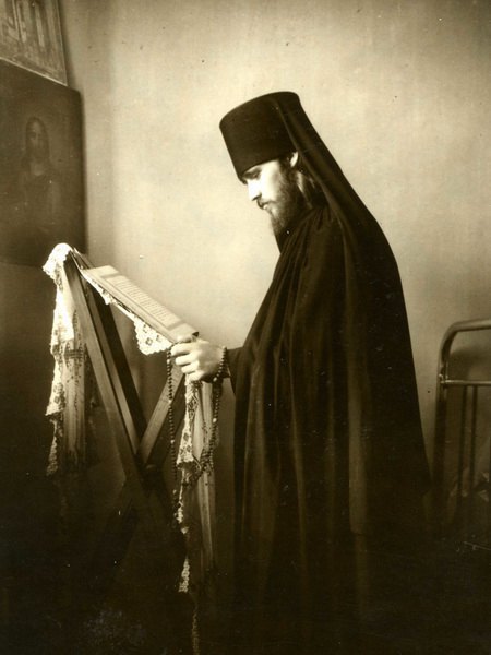 Monk Filaret reads liturgical literature.