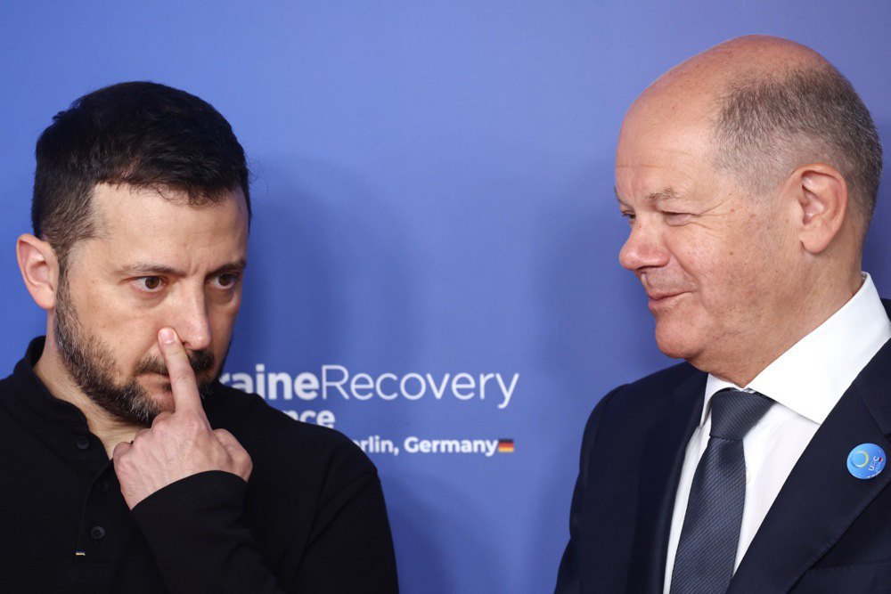 President of Ukraine Volodymyr Zelenskyy and German Chancellor Olaf Scholz speak during a conference on Ukraine's recovery, Berlin, 11 June 2024.