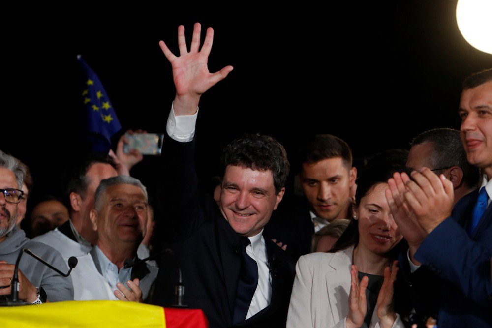 Bucharest Mayor Nicușor Dan celebrates his victory after the announcement of the first exit poll results in Bucharest on 19 May, 2025.