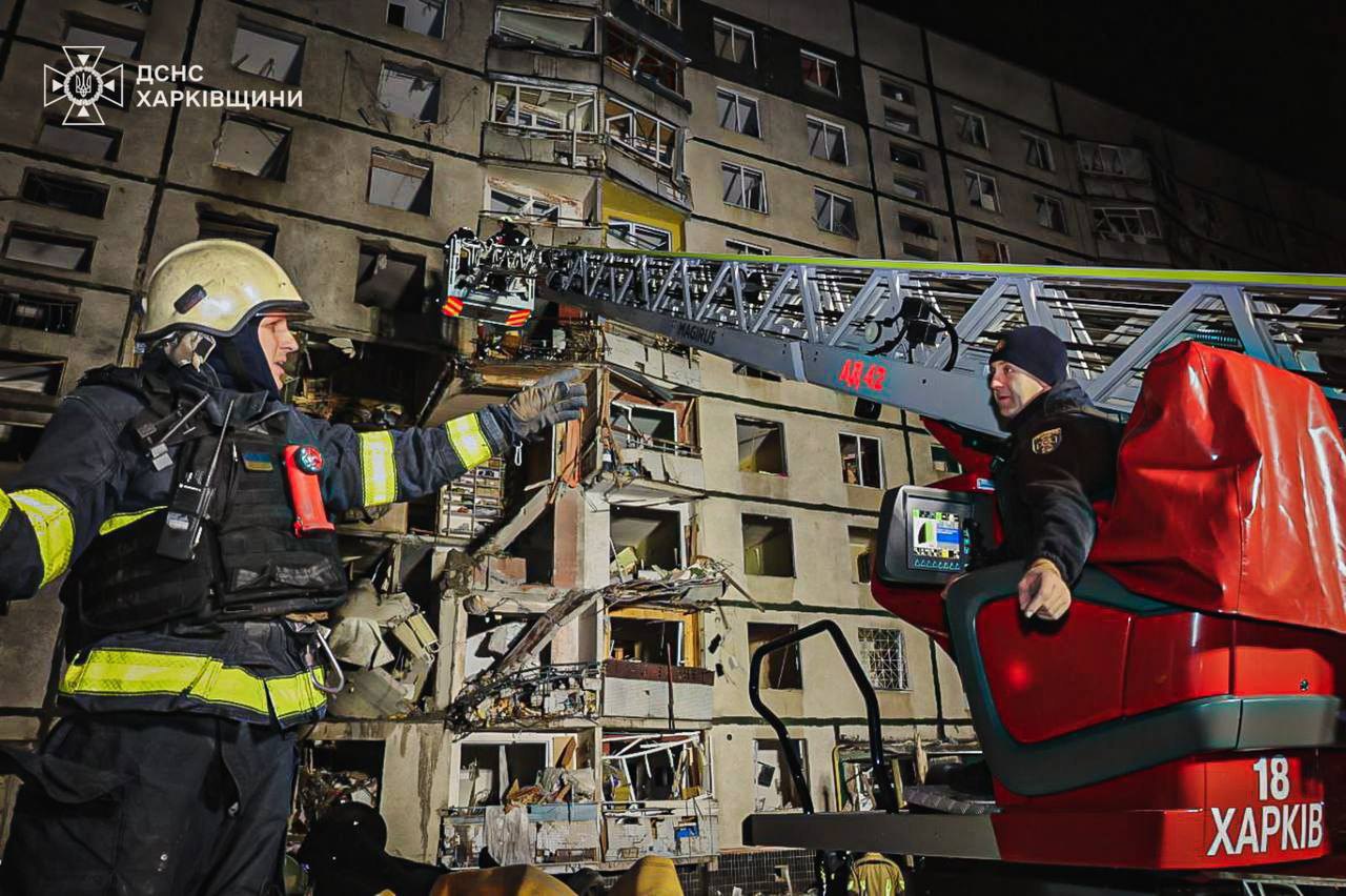 Rescuers work at the site of shelling in Kharkiv