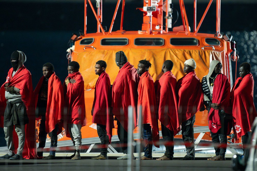 Migrants after being rescued by emergency services on the beach of Las Galietas, southern Tenerife, Canary Islands, Spain, 1 January 2025
