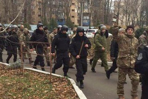 Camouflaged men crash office of former Odesa customs chief