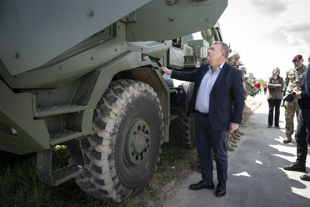 Danish Foreign Minister Lars Rasmussen inspects a Bohdan howitzer during a visit to Lviv