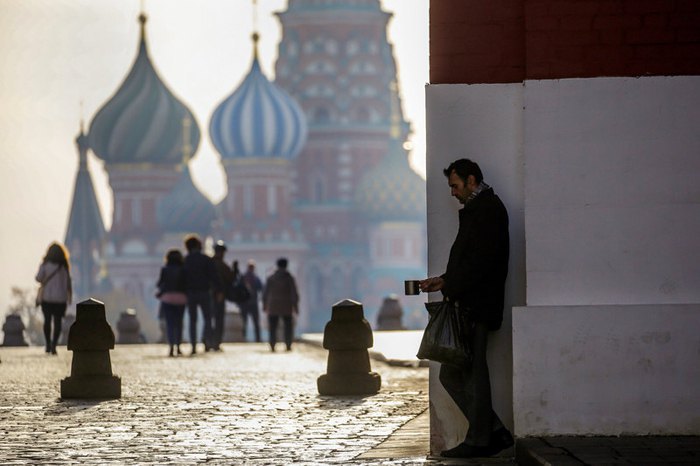 A beggar in front of St Basil's Cathedral on Moscow's Red Square, 16 October 2018.