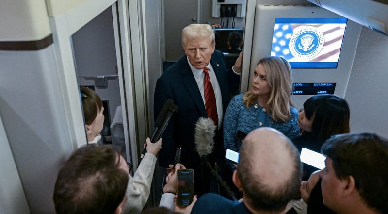 US President Donald Trump talks to journalists