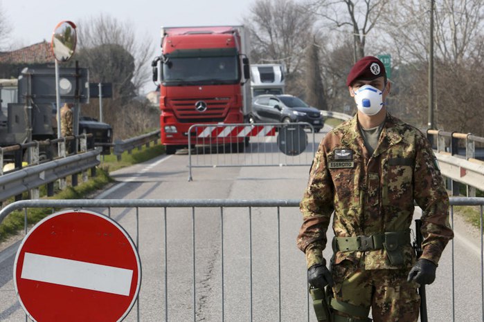 An Italian army officer at a checkpoint at the entrance to Padua, Northern Italy, 24 February 2020.