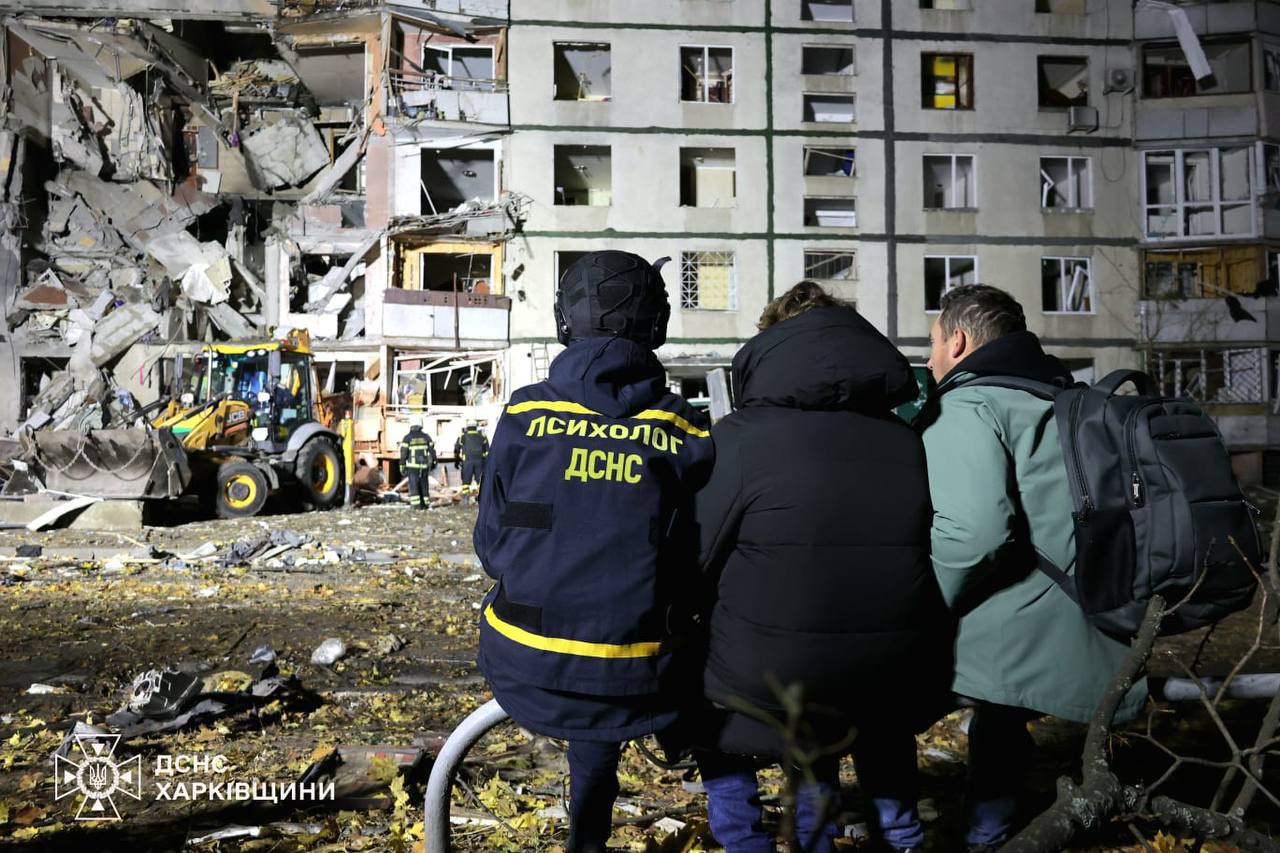 Rescuers work at the site of shelling in Kharkiv