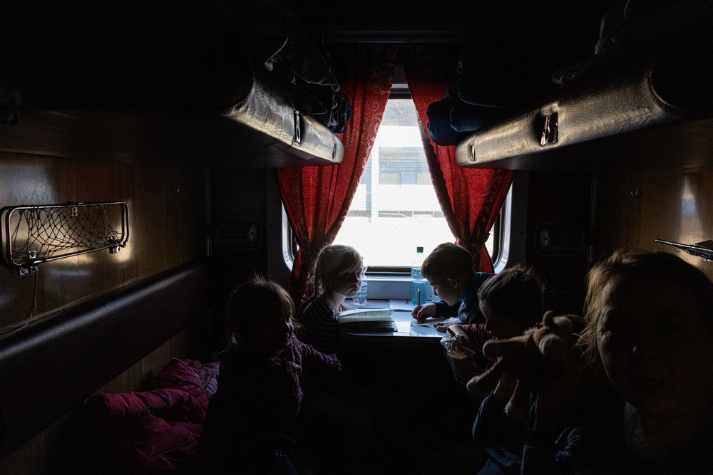Orphans from the occupied town of Polohy travel on an evacuation train to western Ukraine, 26 March 2022