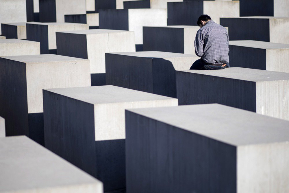 The man visits the Holocaust memorial in Berlin on 7 April, 2018.