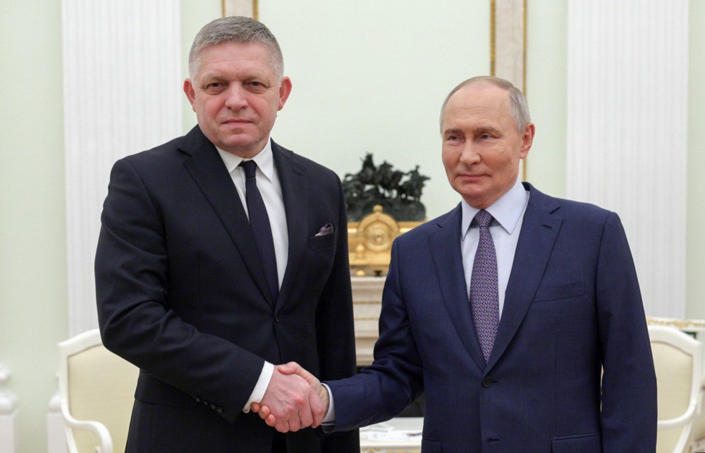 Putin and Slovak Prime Minister Robert Fico (left) shake hands during a meeting in the Kremlin on 22 December, 2024.