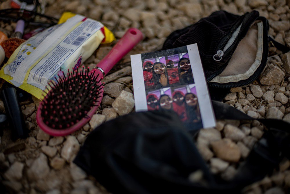 Items are scattered on the ground after a Palestinian attack that killed more than 260 people during a music festival on 7 October near Raim, Israel, 12 October 2023