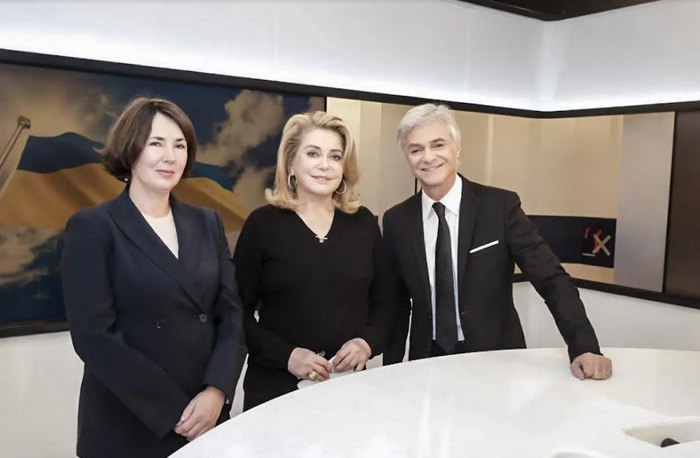 French actress Catherine Deneuve with Cyril Viguier during a TV programme in support of Ukraine, with Ambassador's wife Natalya Omelchenko by their side