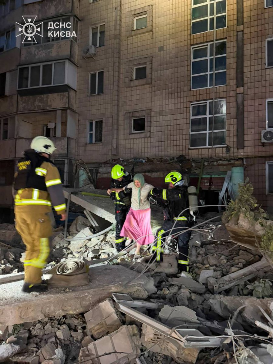  Rescue workers at the scene of the attack in Kyiv