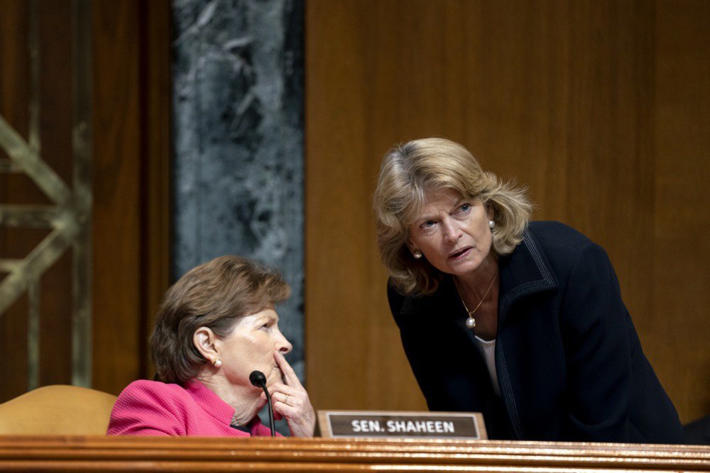 Senator Jeanne Shaheen, a Democrat from New Hampshire (left), speaks with Senator Lisa Murkowski, a Republican from Alaska, during a Senate hearing.