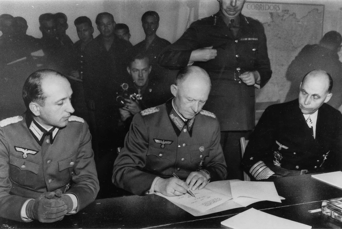 Alfred Jodl signs the German Instrument of Surrender, 7 May 1945.