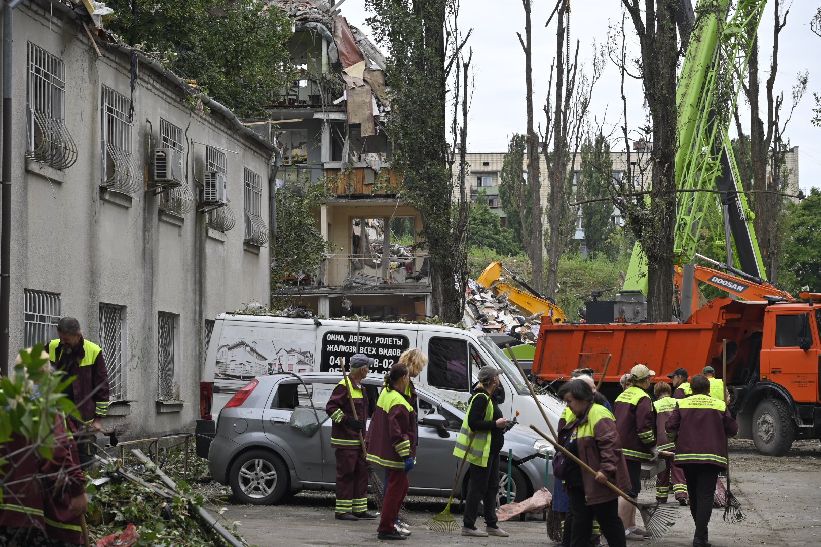 Clean-up crews working at the site of the Russian missile strike