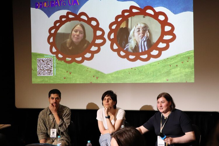 On the screen on the left, film director and screenwriter Mariya Ponomaryova