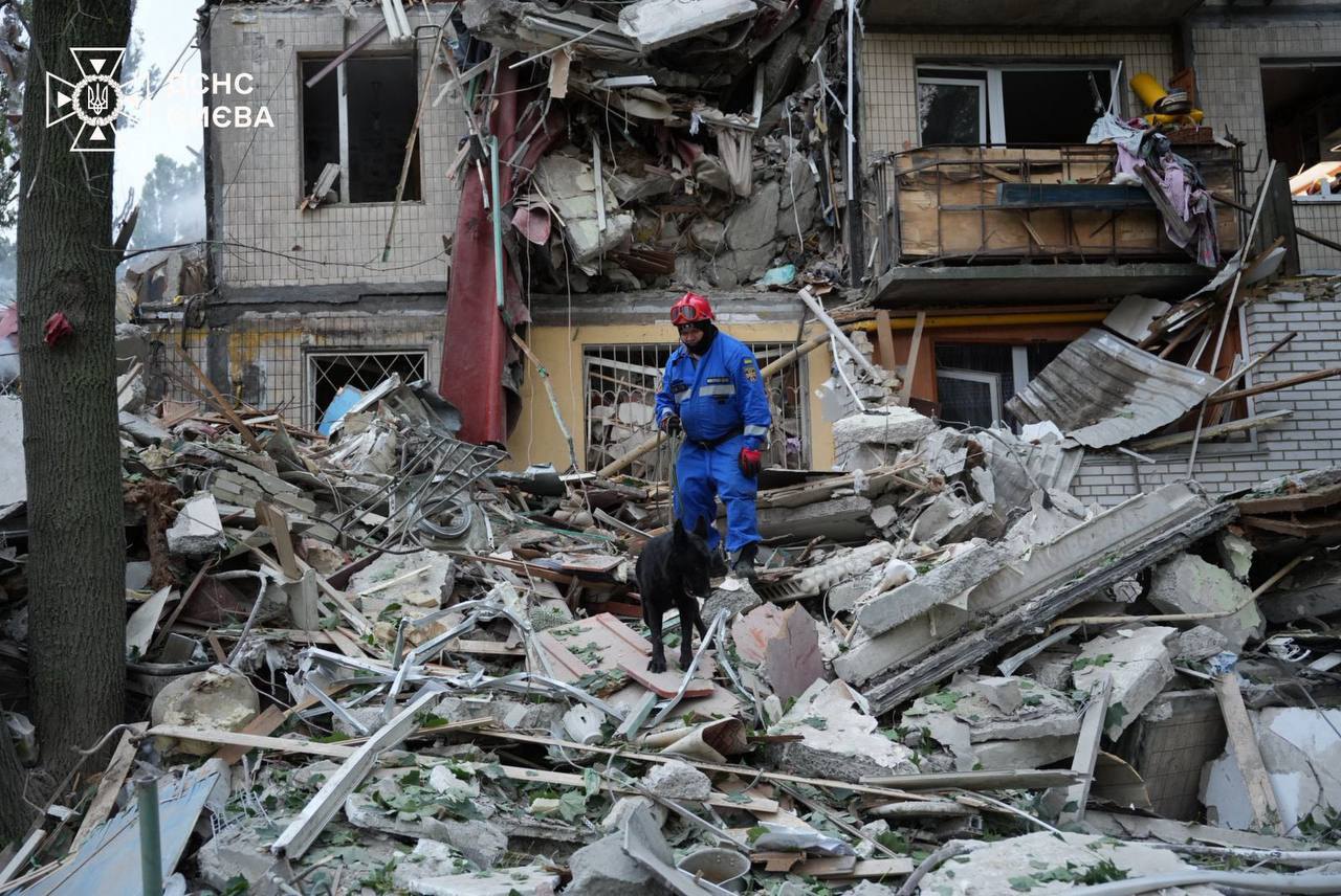 Rescuers working at the site of the Russian attack on Kyiv, 31 July