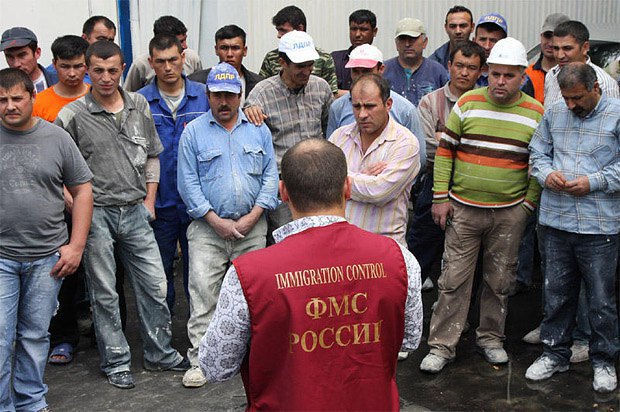 Migration officer talking to citizens of neighbouring states working in Moscow