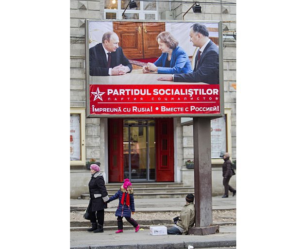 An election poster of the Party of Socialists of the Republic of Moldova: Putin and party leader Dodon (right),
Chisinau, 2014