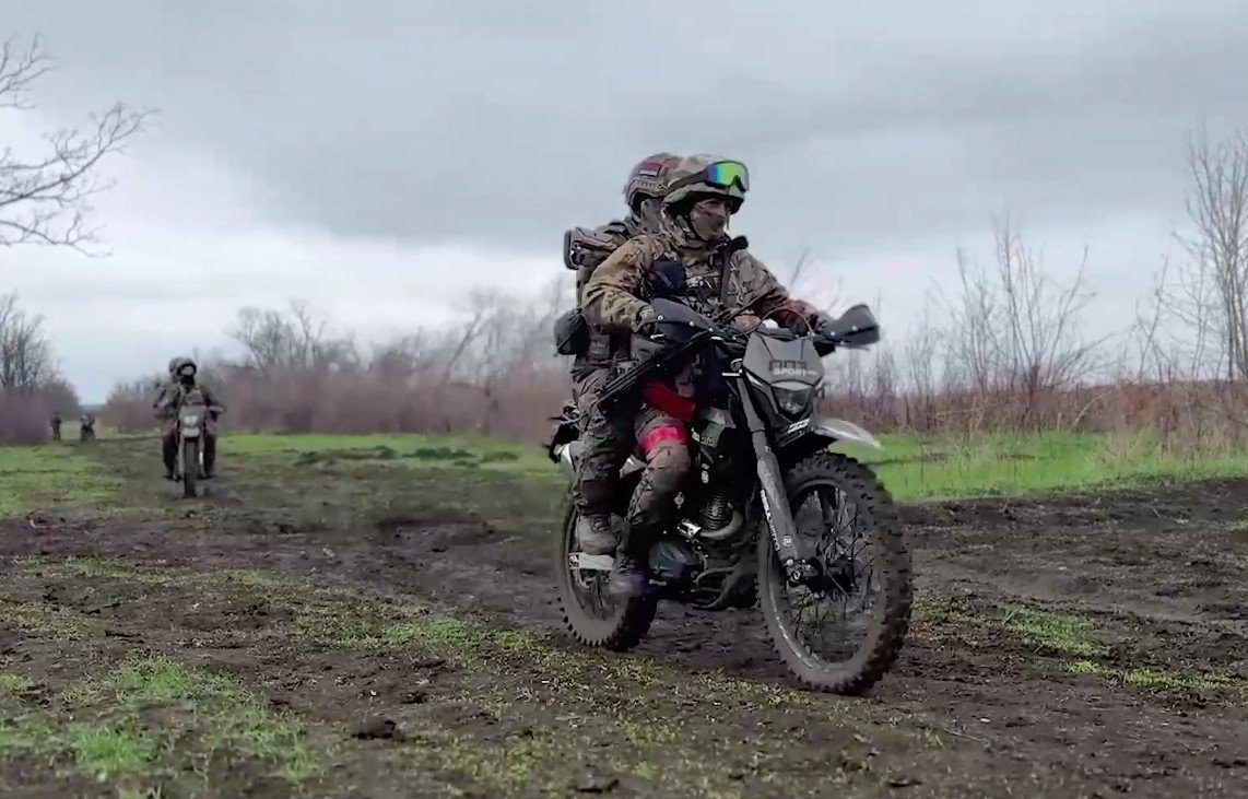 Russians on a motorbike