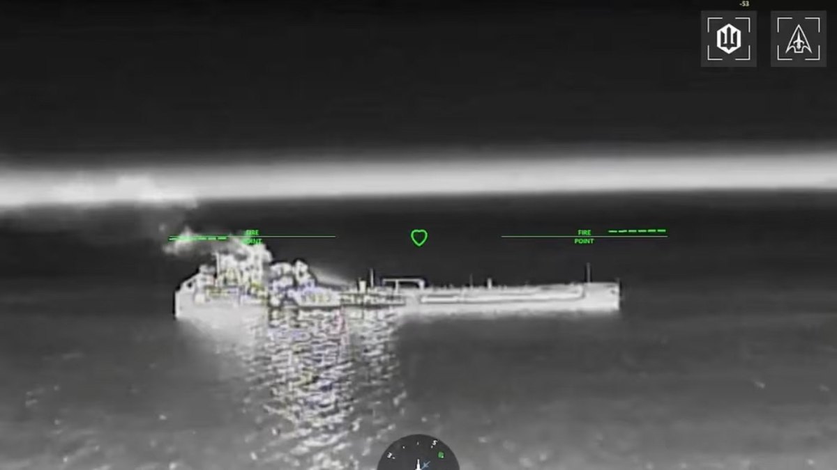 The photo shows smoke rising above the vessel following the strike.