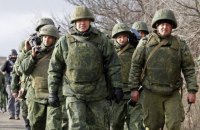 Russian troops make Mariupol residents wear white armbands