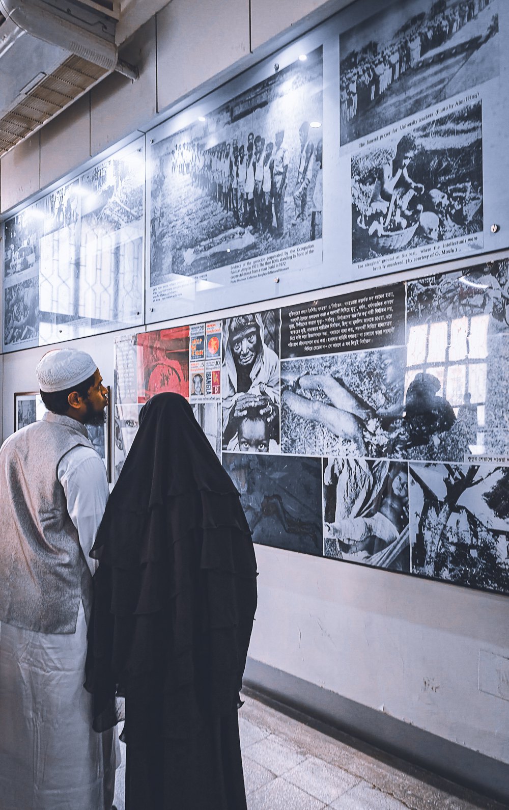 A couple of Bengali Muslims examine an exhibition at the National Museum of Bangladesh