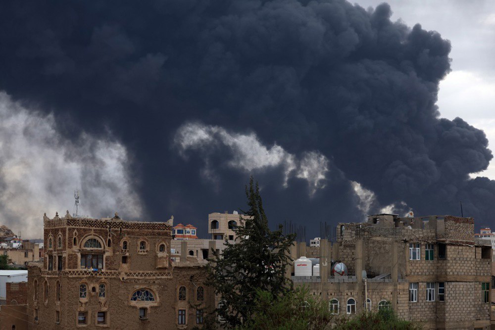 Smoke rises over buildings after airstrikes in Sanaa, Yemen, 6 May 2025.