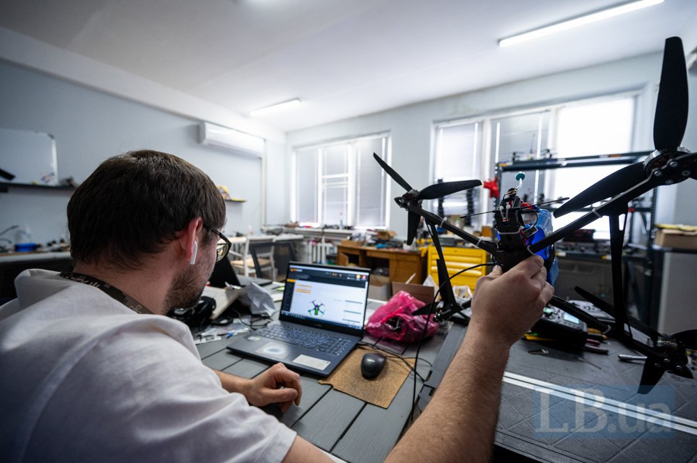 Master adjusting a drone